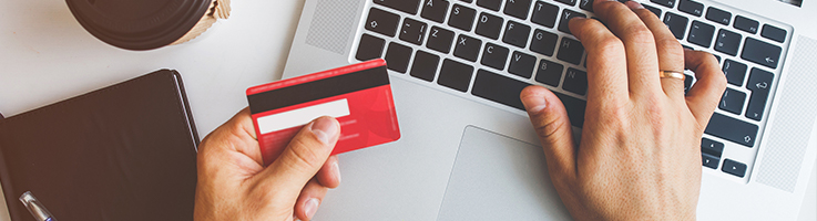 woman holding credit card